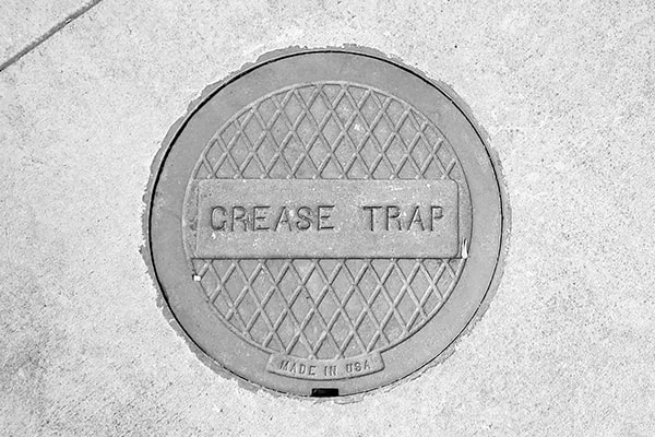 it is necessary to completely empty a grease trap during grease trap pumping in order to remove all built-up grease and solids